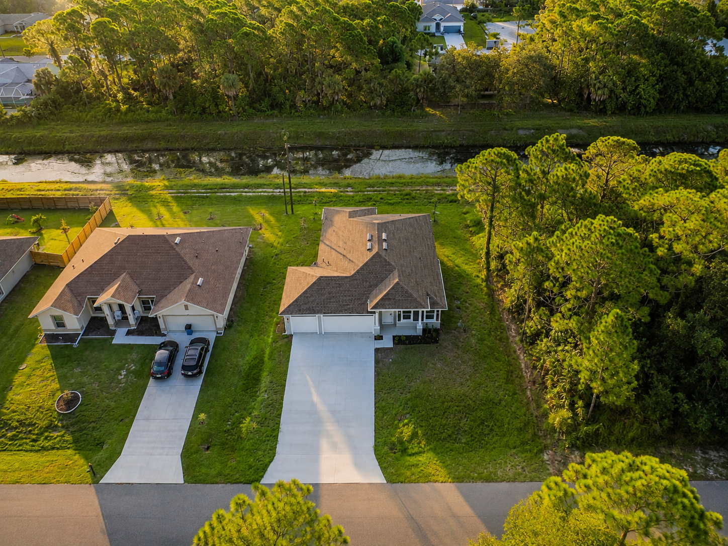 Aerial view of homes and wooded residential lots
